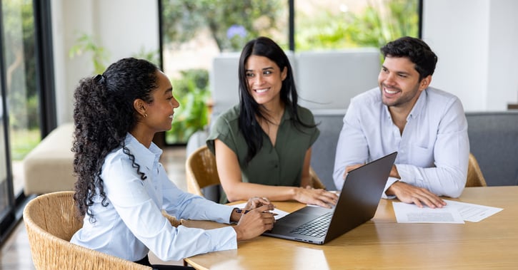 Happy real estate agent and clients