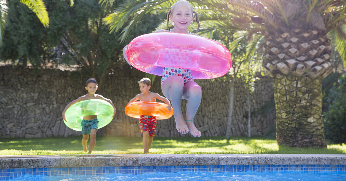 Kids Jumping into a Pool