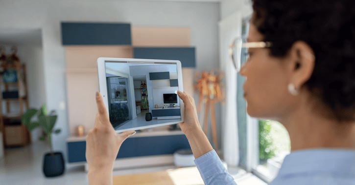 Woman taking a photo of her wall