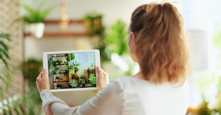 Woman taking photo of home decor