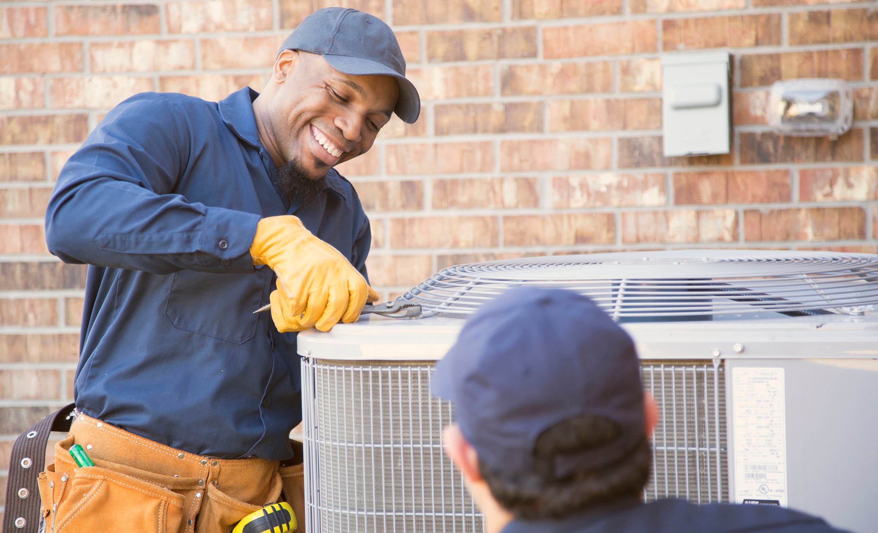 An ORHP network service provider repairs an air conditioning unit.