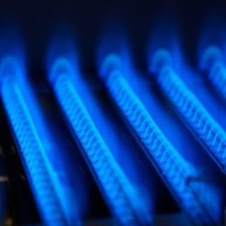 Blue flames inside a gas furnace.