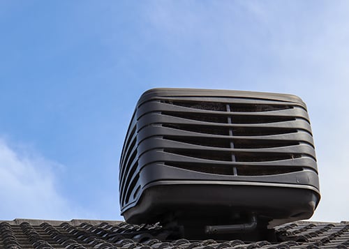 Rooftop mounted air conditioning condenser that meets new 2023 SEER requirements.