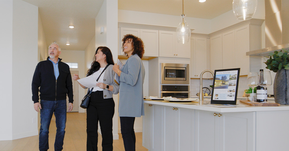 Agent Showing a New Home to Prospective Buyers