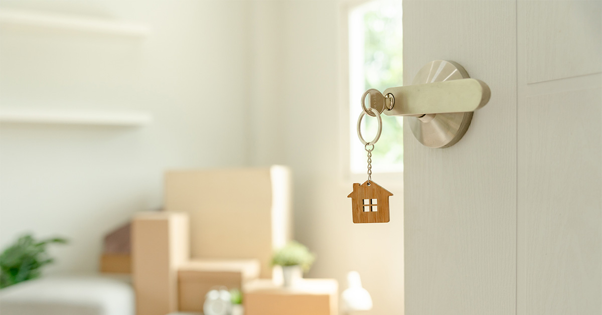 Key inserted into the door of a new home