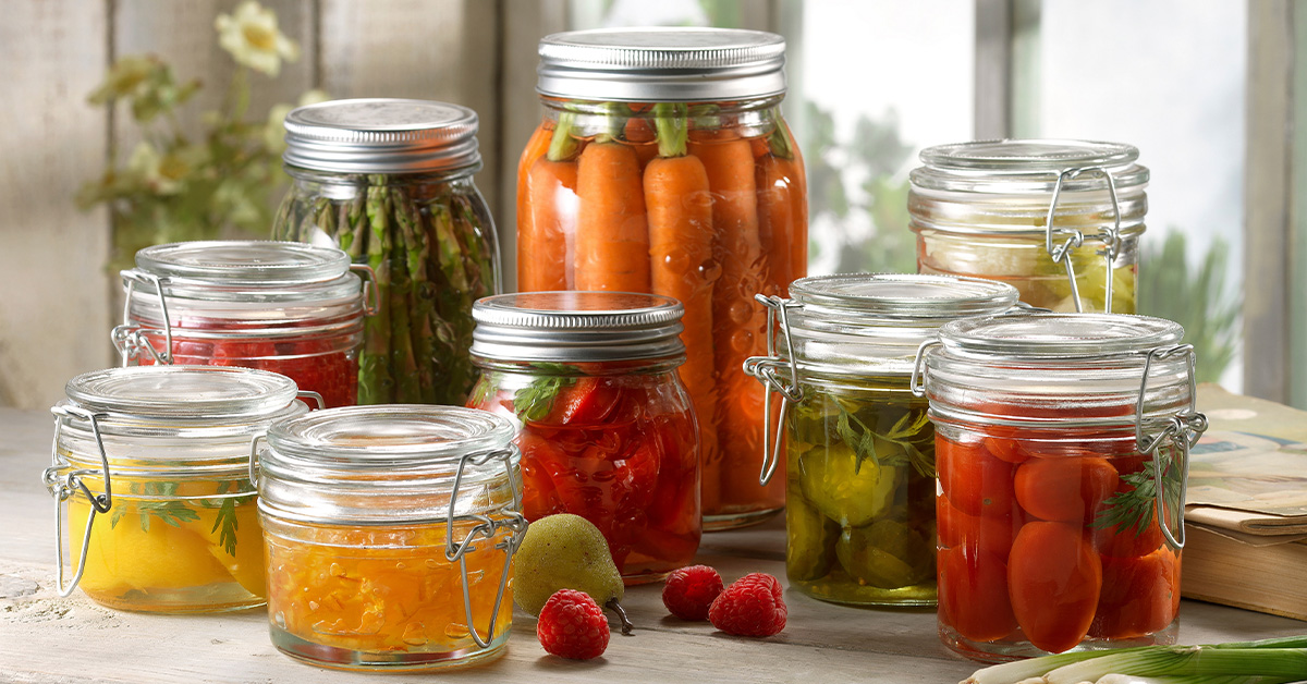 Variety of fruit and vegetables pickled in jars