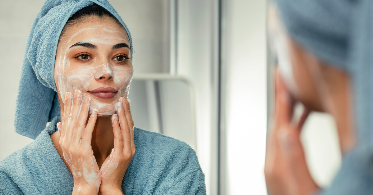 Woman washing her face