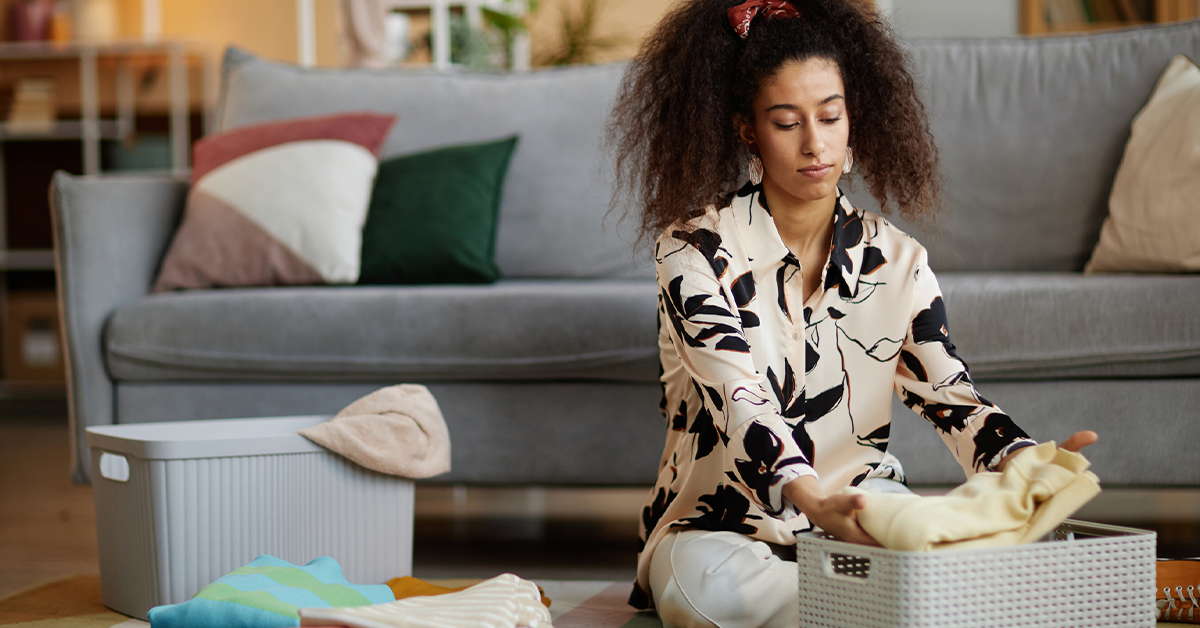 Young woman decluttering home